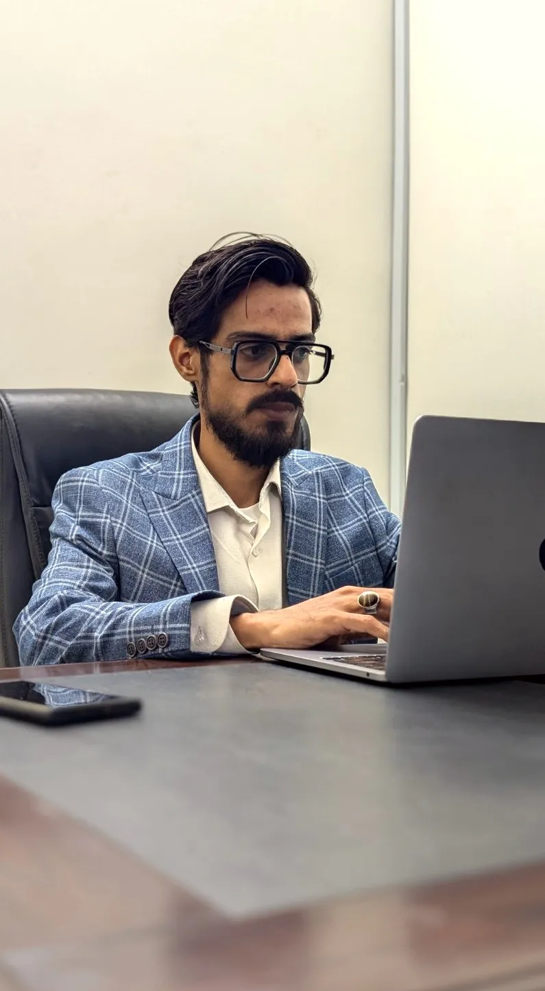 Khurram Shahzad working at a laptop