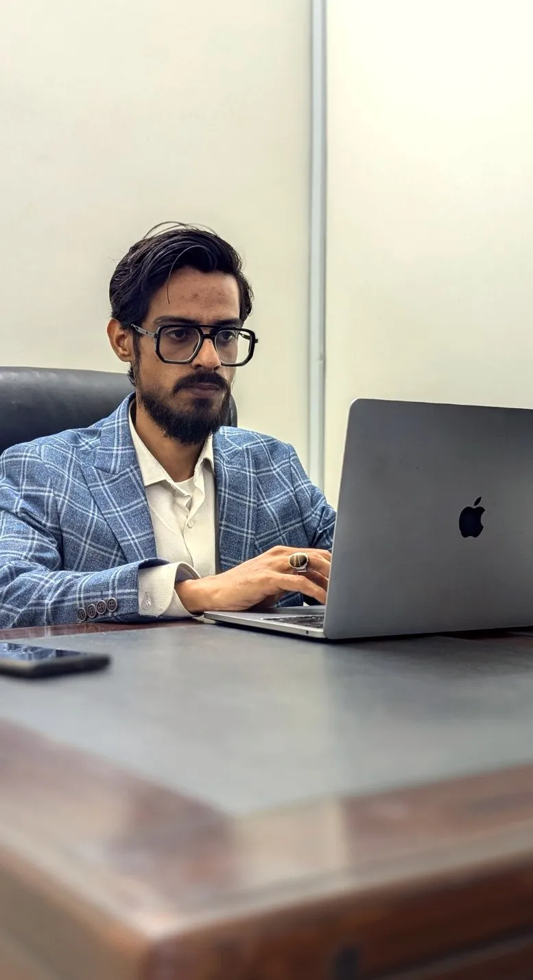 Khurram Shahzad working at a laptop