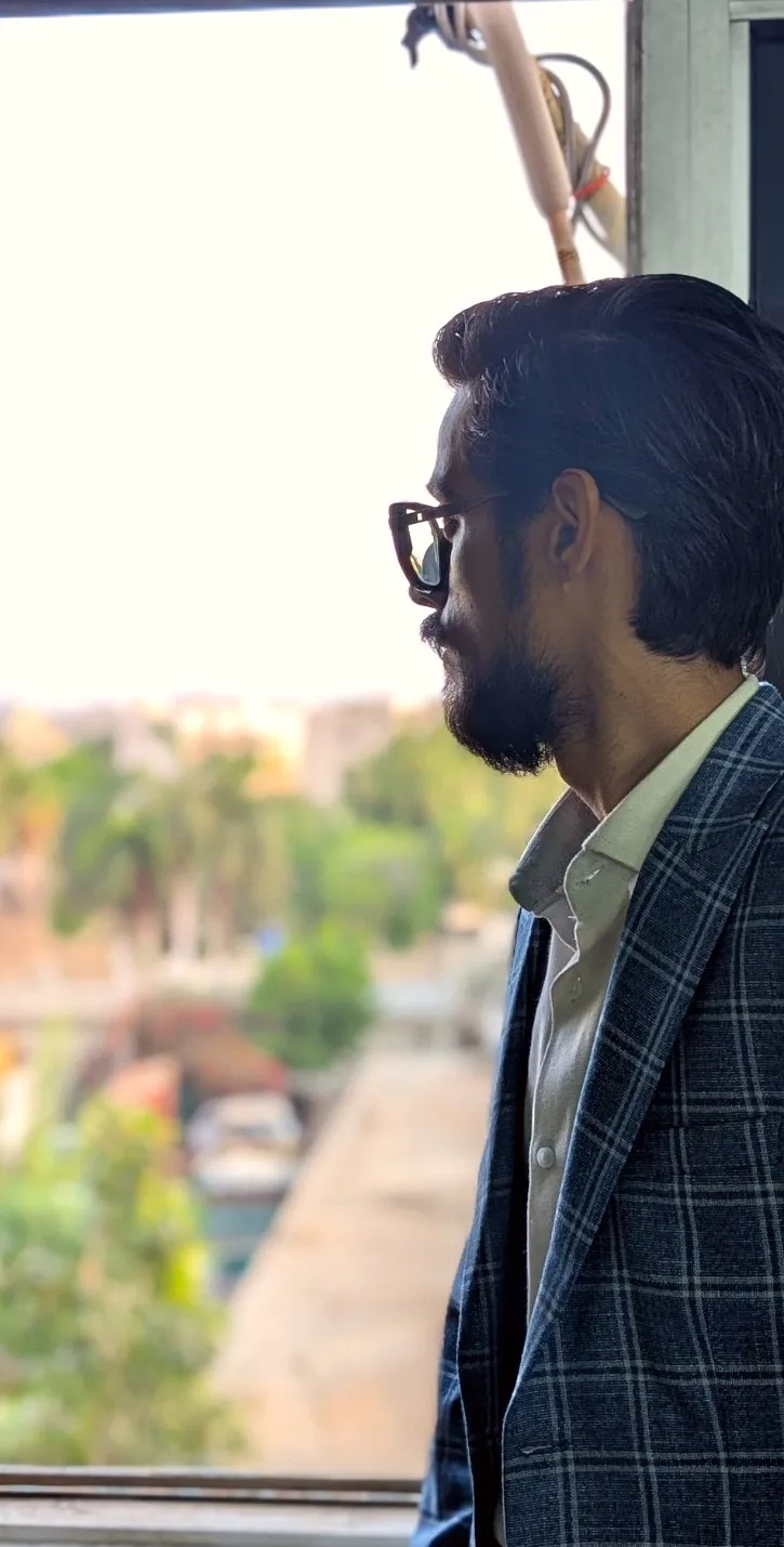 Khurram Shahzad by the window